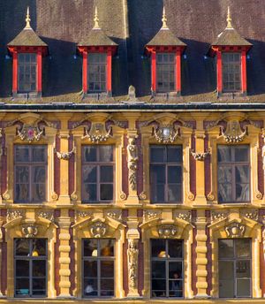Color architectural photograph of a vibrant yellow facade with red casement windows and triangular pediments in Lille by William Curtis Rolf. Lille France Architectural Facade Study 2 Color Print