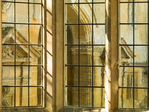 Color architectural photograph looking through the historic thousand-pane oriel window at Stanway House in Gloucestershire by William Curtis Rolf. Stanway House Great Hall Oriel Window Color Print