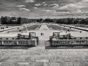 Fine-art black and white panoramic photograph by William Curtis Rolf looking down the grand staircase toward the formal parterre gardens at Château de Vaux-le-Vicomte, France. Chateau de Vaux le Vicomte Panoramic Perspective Fine Art Print