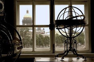 Color photograph of an antique armillary sphere inside the Kunstkamera with a window view of St. Isaac's Cathedral in St. Petersburg by William Curtis Rolf, prized by global collectors on 1stDibs. Peter the Great Cabinet Kunstkamera Armillary Sphere St Isaac's Cathedral Color Print
