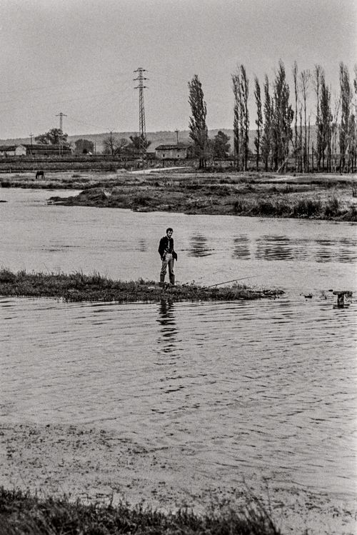 Man standing in river Countryside near Oviedo, Spain 1974