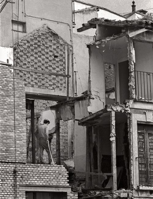 Workman doing renovation of a building in Toledo, Spain 1974. Photographer Nancy LeVine