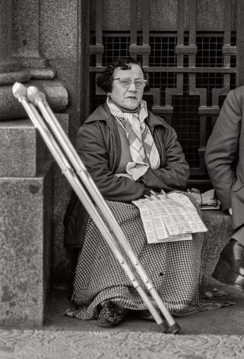 Woman with tickets and crutches Plaza de Cataluna, Barcelona, Spain 1974