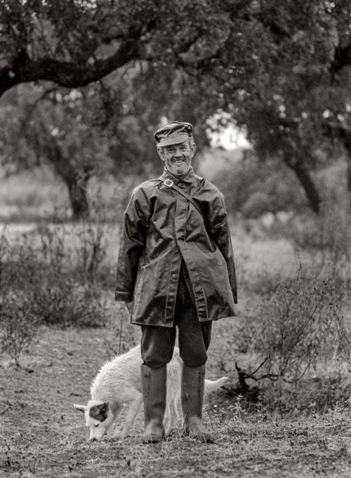  Man with Dog on rainy day in the countryside near Don Benito, Spain 1974. Photographer Nancy LeVine