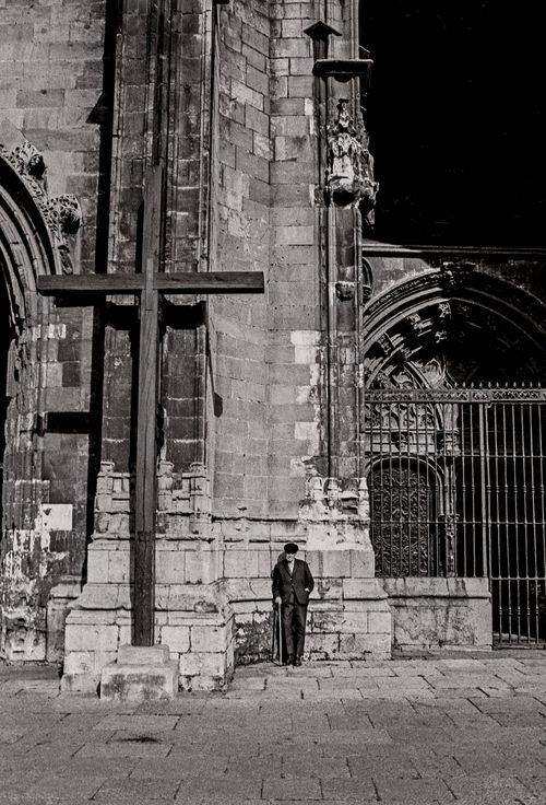 Man standing next to huge cross Spain, 1974