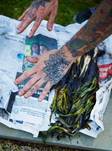 Chef Jose Andres (blue vest) cooks outside at RdV Vineyards. A140507_Jose_Andres_VA_FW
