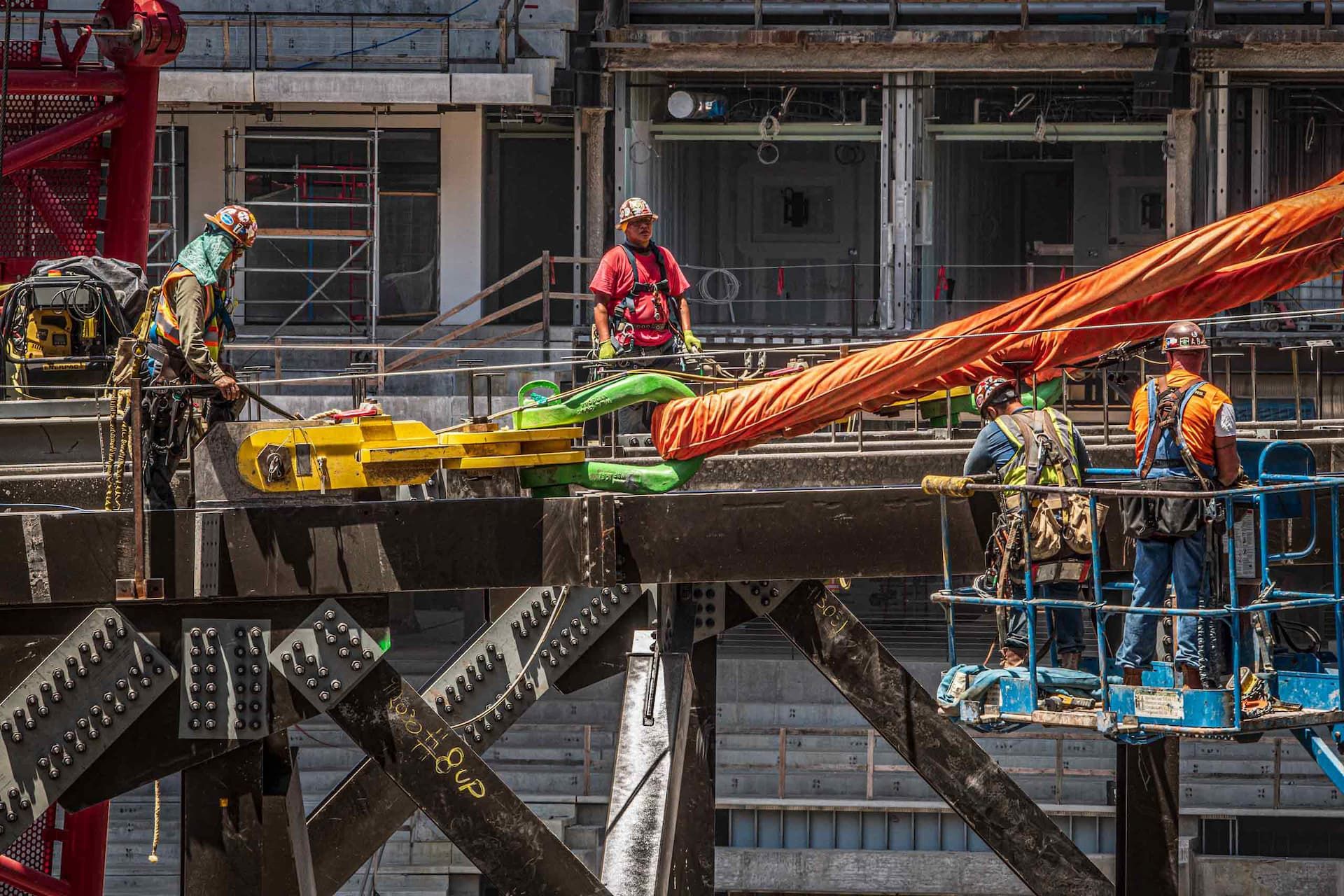 Industrial photo of steel workers building Globe Life Field, showcasing structural engineering and construction efforts. Steel Workers Constructing Globe Life Field