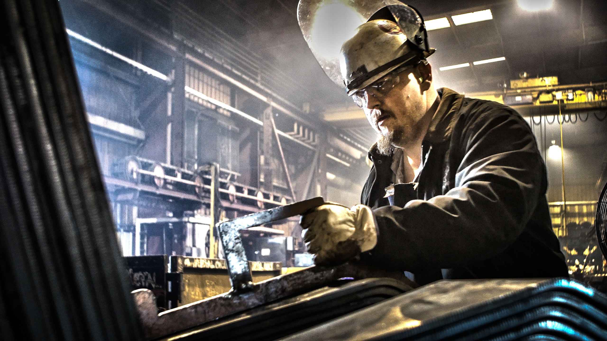 Industrial photo of metal fabrication during rail car manufacturing, showcasing craftsmanship and precision in industrial production. Rail Car Manufacturing Metal Fabrication