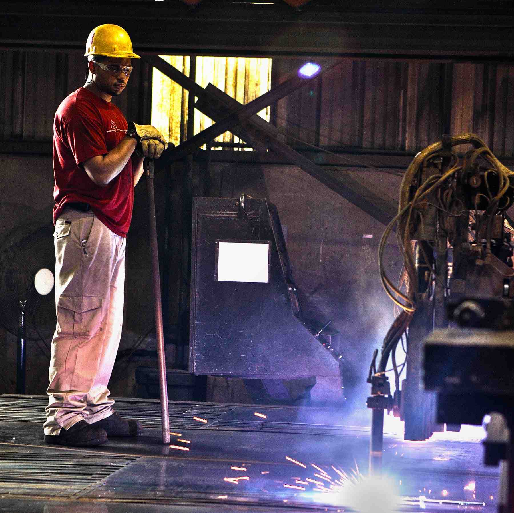 Seamless Automation: Plant Worker Operating an Automated Metal Torch