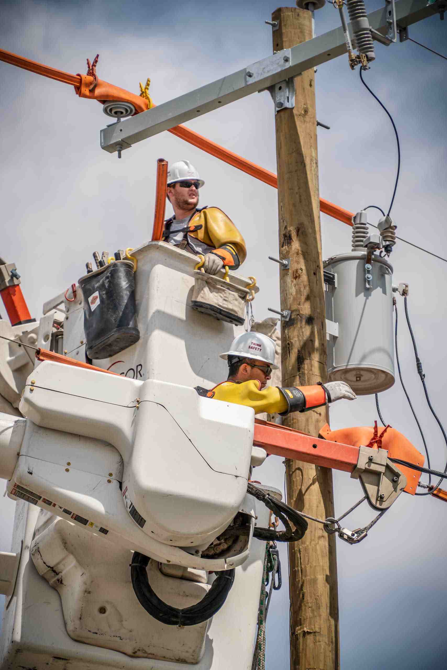 Linemen working on electrical grid
