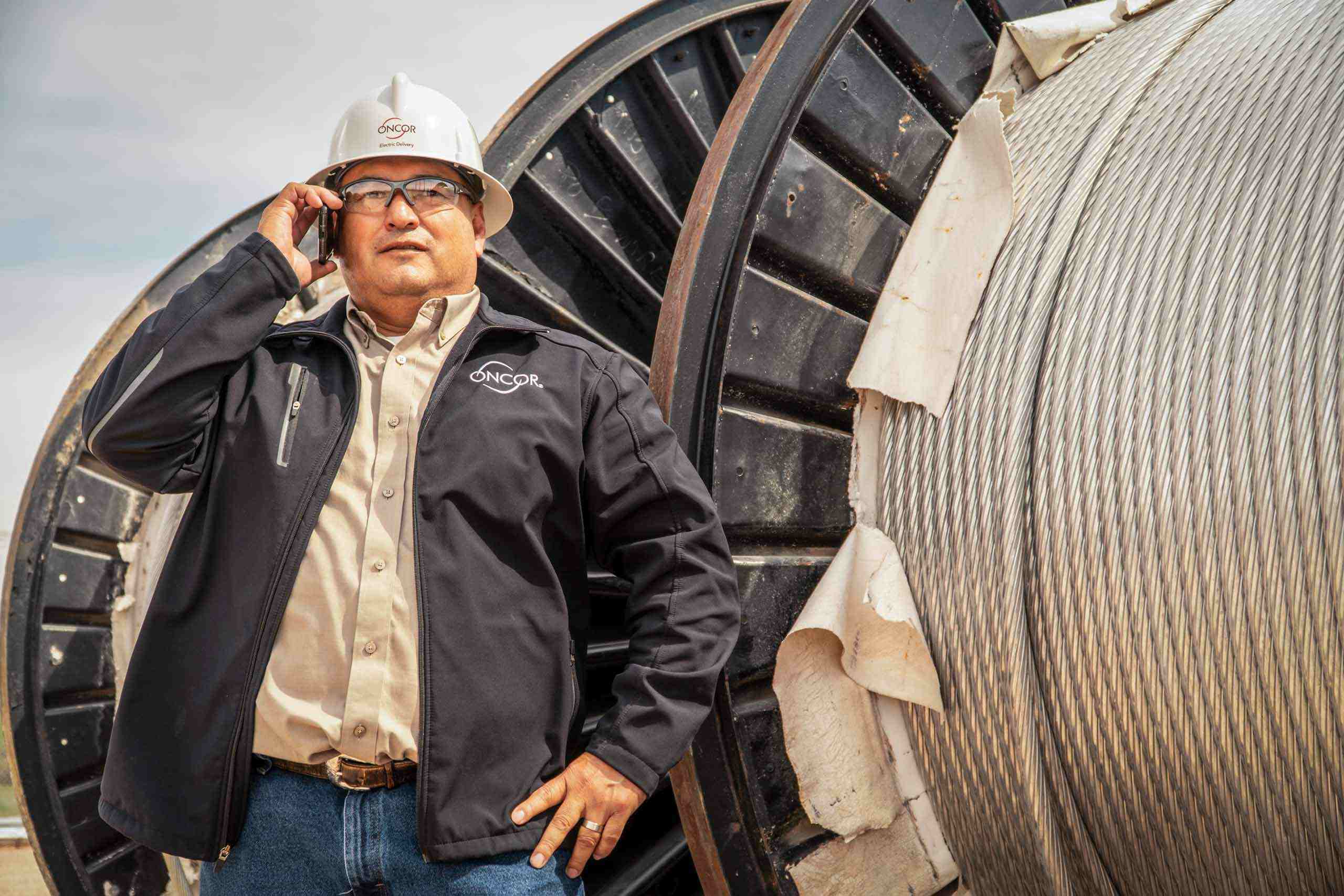 Powerful On-Location Portraits of Oncor Manager amidst Cabling