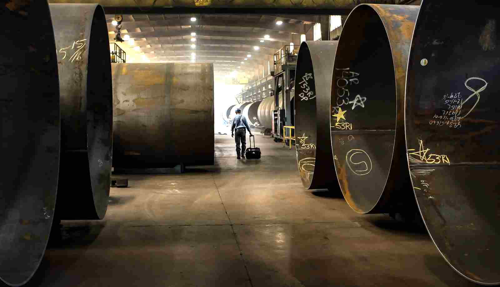 Inspector Ensuring Quality in Tank Car Manufacturing Process