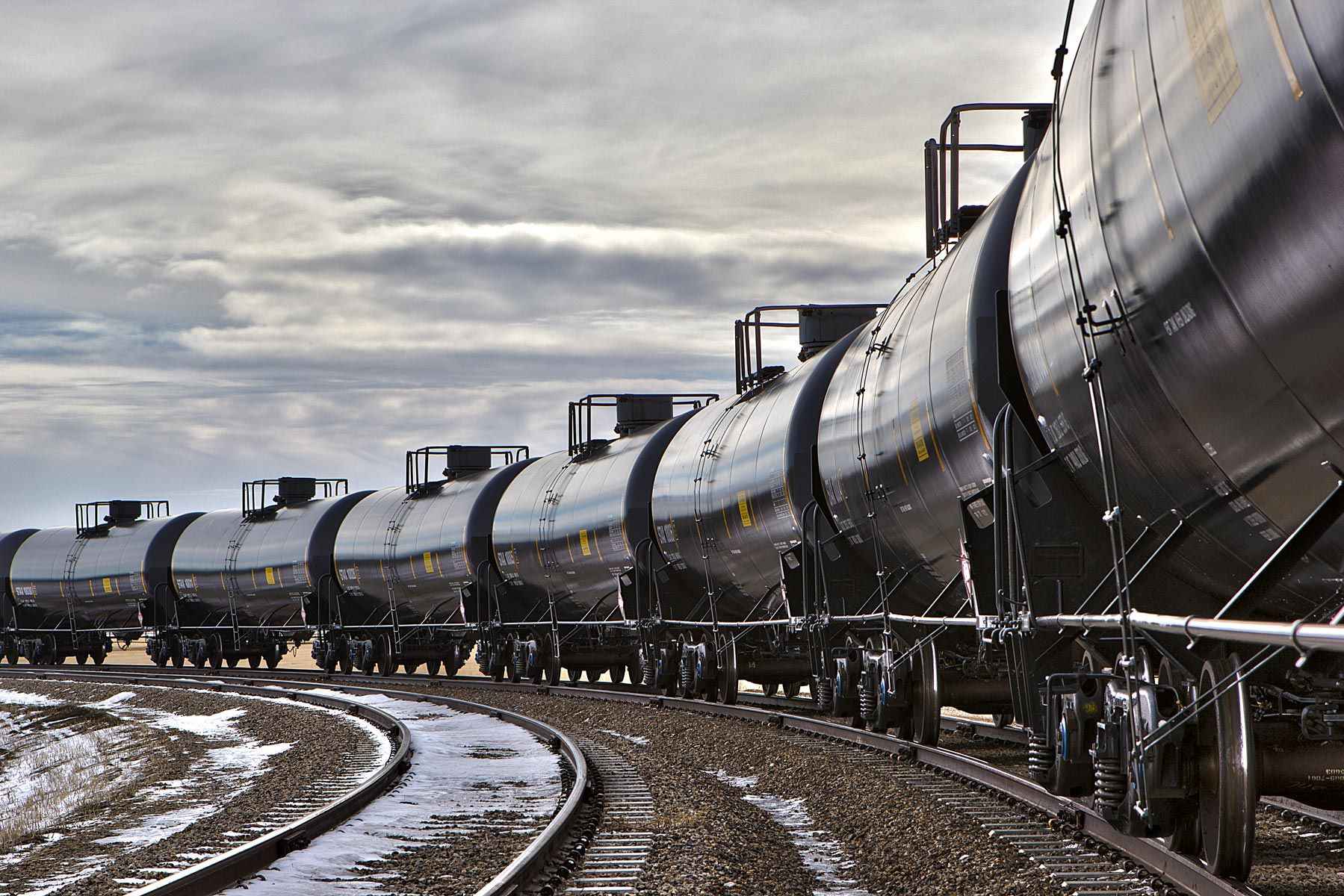 Industrial photo of tank cars being loaded at a facility in South Dakota, emphasizing logistics and operational efficiency. Tank Cars Loading at South Dakota Facility