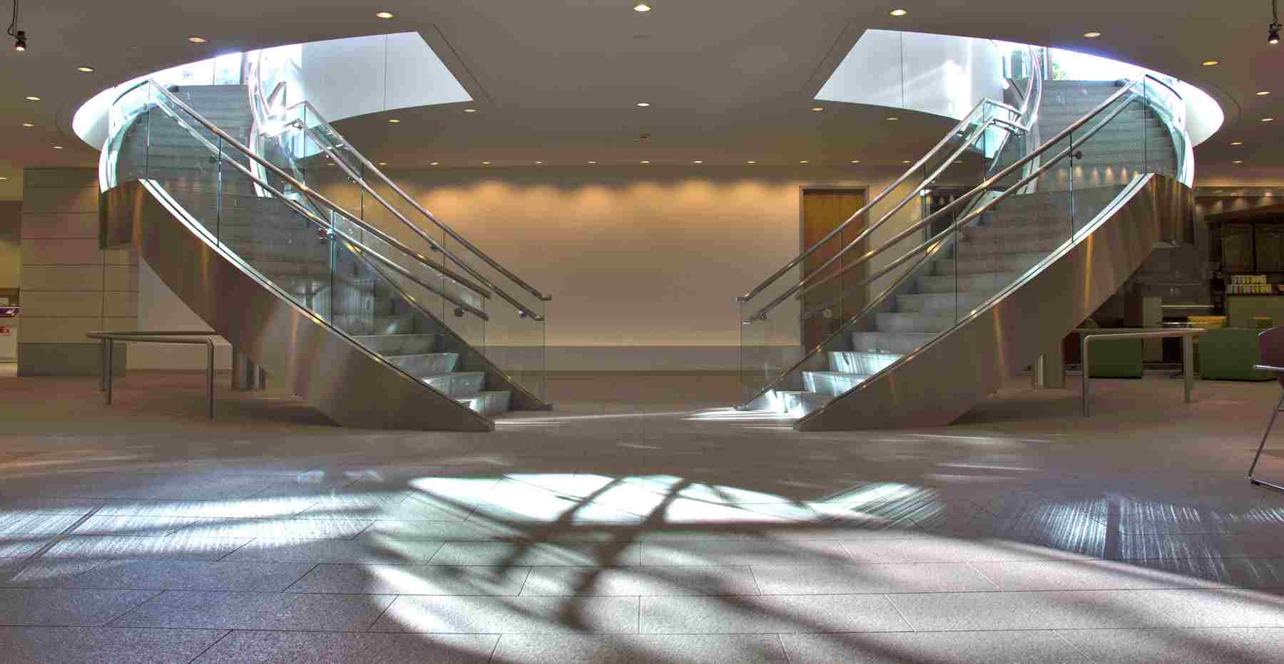 Twin staircases leading from lobby. Great design, photography by Architectural Photographer Ray Payne Architecture-advertising Photography Dallas .jpg