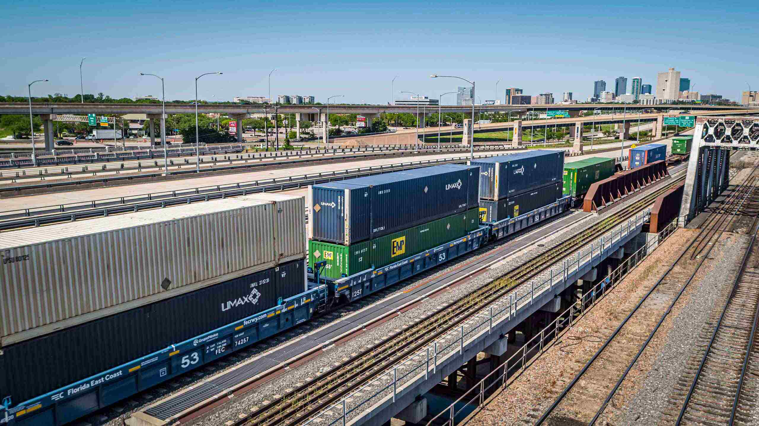 Aerial industrial photo showing the railway supply chain in action, emphasizing the transport of goods for commercial and industrial purposes. Drone Photo of Railway Supply Chain - Industrial Logistics