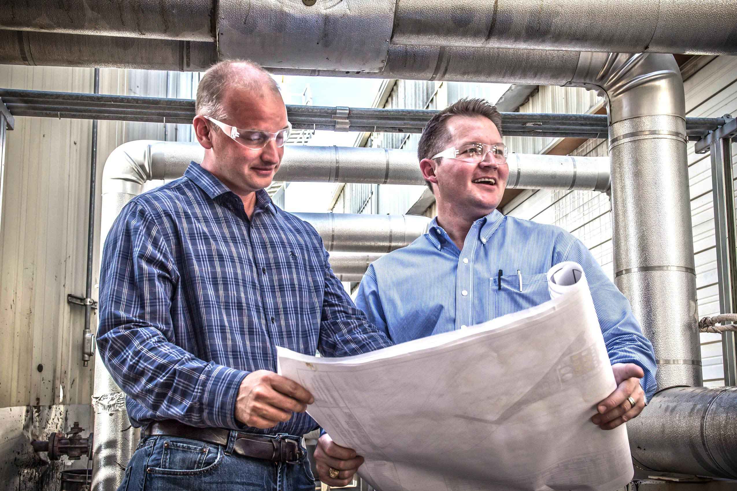 Business portrait of asphalt plant managers highlighting leadership and teamwork in an industrial setting, captured in Dallas. Asphalt Plant Managers - Corporate Portrait Dallas