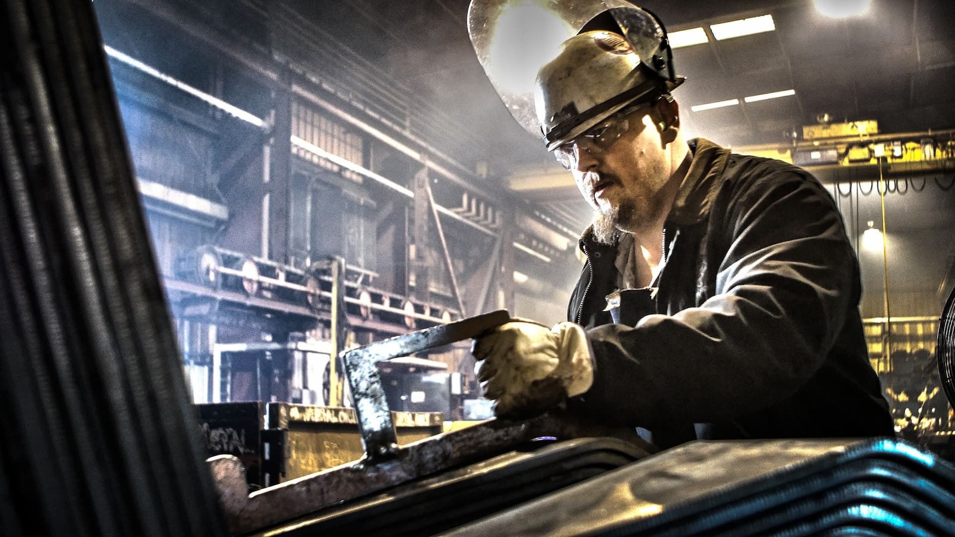 Industrial photo of metal fabrication during rail car manufacturing, showcasing craftsmanship and precision in industrial production. Rail Car Manufacturing Metal Fabrication