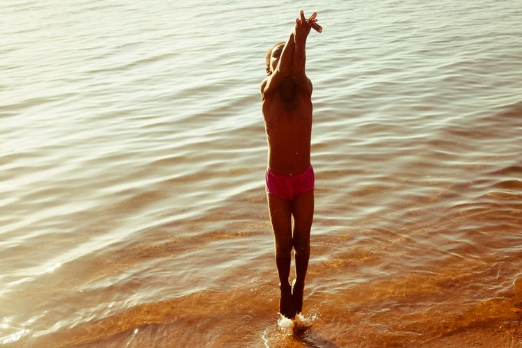 malawi_child_jumping_sea_playing.jpg