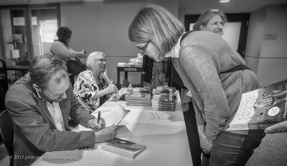 Forrest Pritchard inscribes a copy of his book, "Gaining Ground" for Janet Katz, consultant for Stewards of the Heartlands. Forrest Pritchard-70-Edit.jpg
