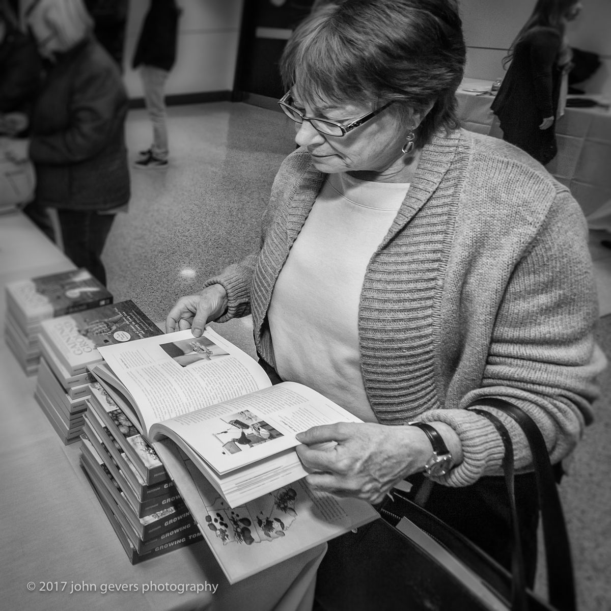 An event attendee checks out Forrest Pritchard's latest book, "Growing Tomorrow." Forrest Pritchard-35-Edit.jpg