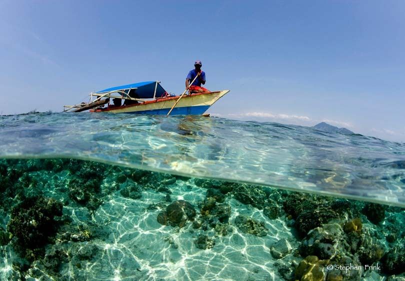 Local fisherman on skiff, Indonesia