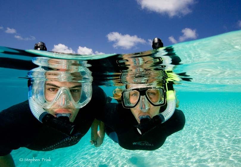 Two snorkelers in calm, clear water, Turks and Caicos.