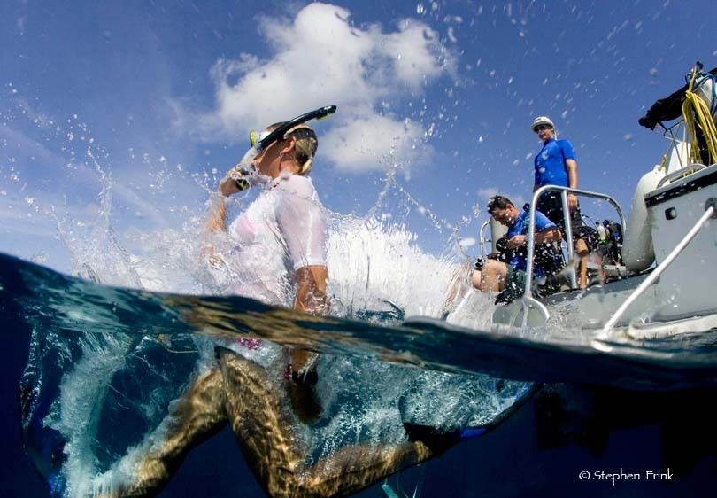 Snorkeler performs Giant Stride Entry into Water from Dive Boat