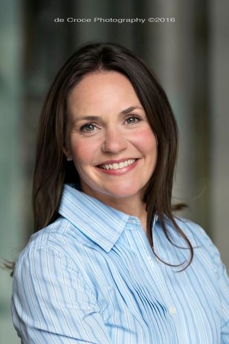 The vertical headshot portrait was made by the commercial business photographers on location in downtown Denver. Vertical Headshot Denver Photography