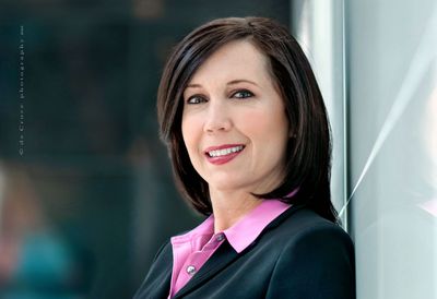 This stunning business head-shot portrait was created on location for WPX Energy by Denver business photographers at DeCroce. The slight low-angle portrait of this executive woman is uncommon. Make-up by Suzanne Blons Busines Woman Head-Shot.jpg