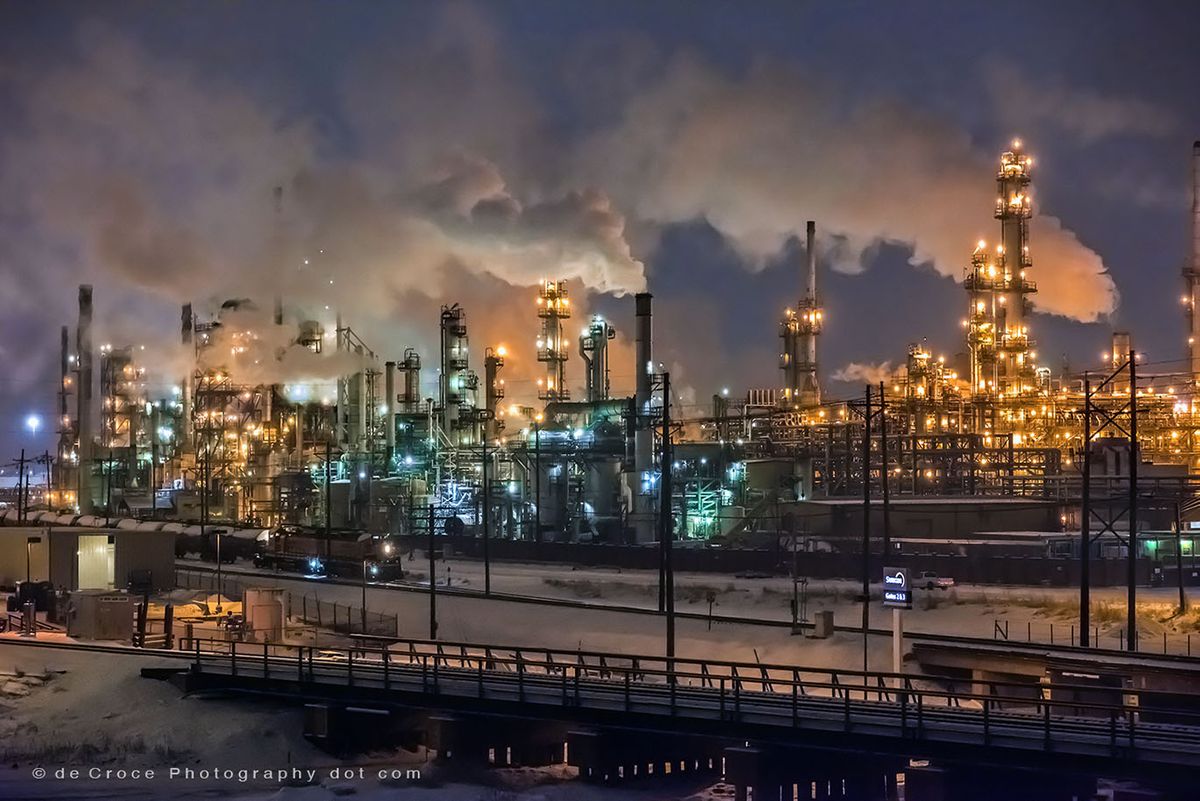 Plumes of smoke and vapor SunCor Oil Refinery in this commercial photograph. Industrial Photography