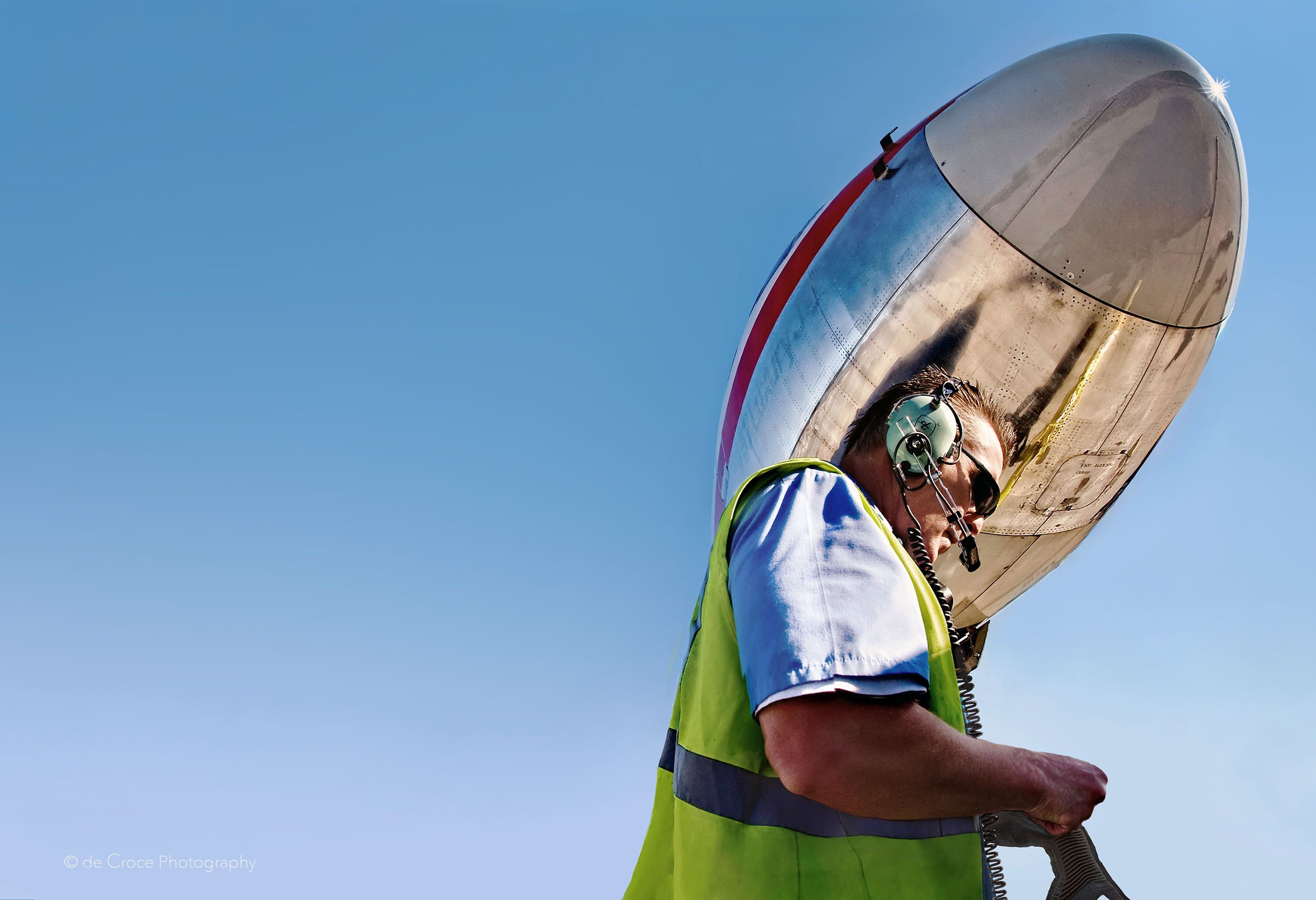 Industrial Airport Worker. Photographed by American industrial photographer, Edward DeCroce.