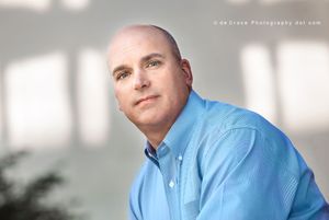 This casual executive portrait photograph was done on location in downtown Denver for NextecGroup in Seattle. Denver executive businessman casual portrait