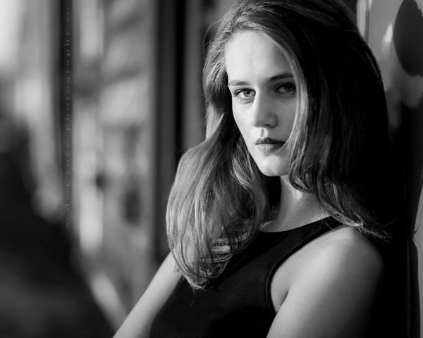 Split light dramatizes actorhead shot in black and white model portfolio photography Denver Model Head Shot Photography