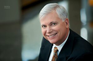 This business portrait headshot for a WPX Energy executive demonstrates a photographic tecnique utilizing a very small depth of field. Energy Executive Portrait Photography