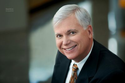 This business portrait headshot for a WPX Energy executive demonstrates a photographic tecnique utilizing a very small depth of field. Energy Executive Portrait Photography