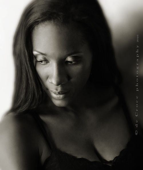 Denver model photographer capture sublime mood of singer Ithalia Johnson in this stunning black and white image. The advertising photo-shoot was done as part of an promotional photography project for the super singer/musician. African American Singer Portrait