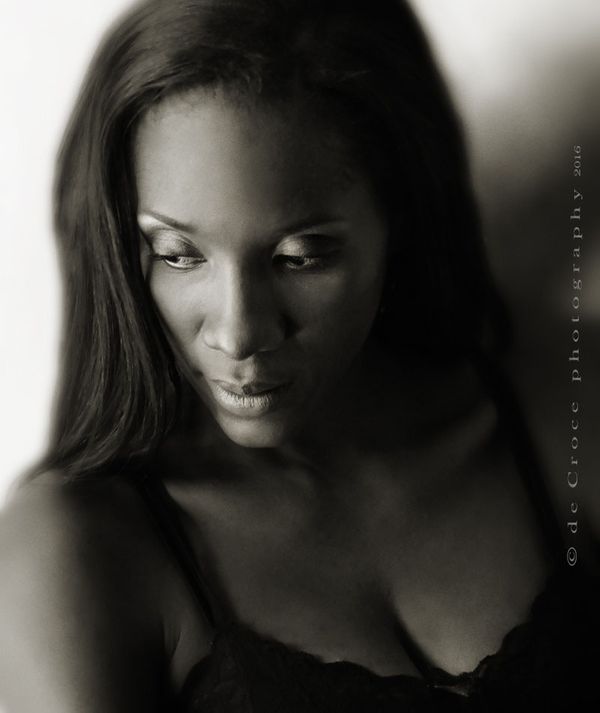 Denver model photographer capture sublime mood of singer Ithalia Johnson in this stunning black and white image. The advertising photo-shoot was done as part of an promotional photography project for the super singer/musician. African American Singer Portrait