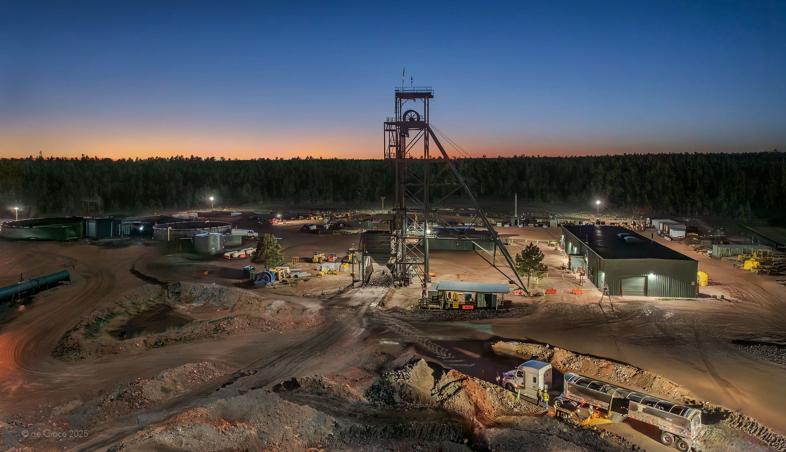 Denver commercial photographers at DeCroce Photography traveled to Grand canyon for industrial photoshoots. This image of the surface of a uranium mine operated by Energy Fuels was shot at late dusk, almost night, demonstrating ming activity after dark. The aerial drone perspective depicts loading uranium ore into transport semi trucks. Uranium Mine - Night Aerial Photography - Arizona