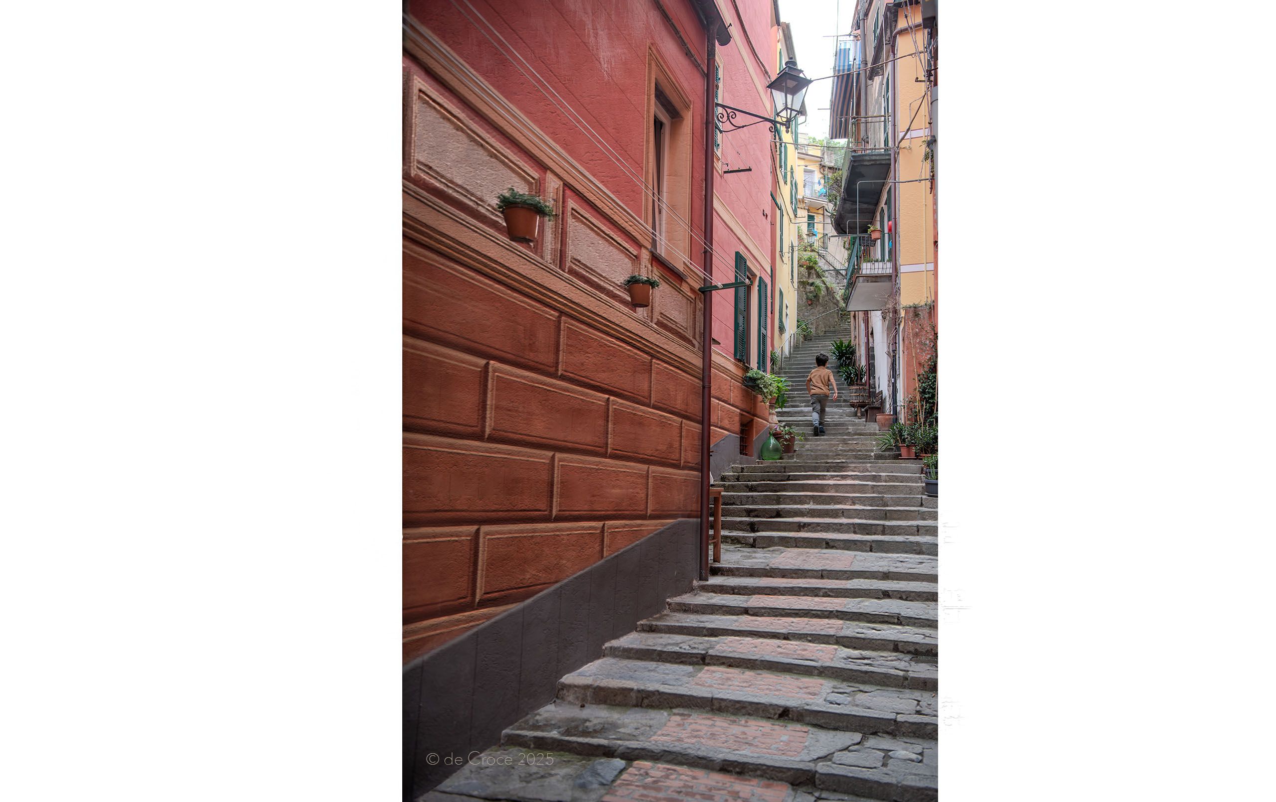 boy climbs step steps in Italy treavel photography Boy Up Steps Monterosso al mare Cinque Terre Italy