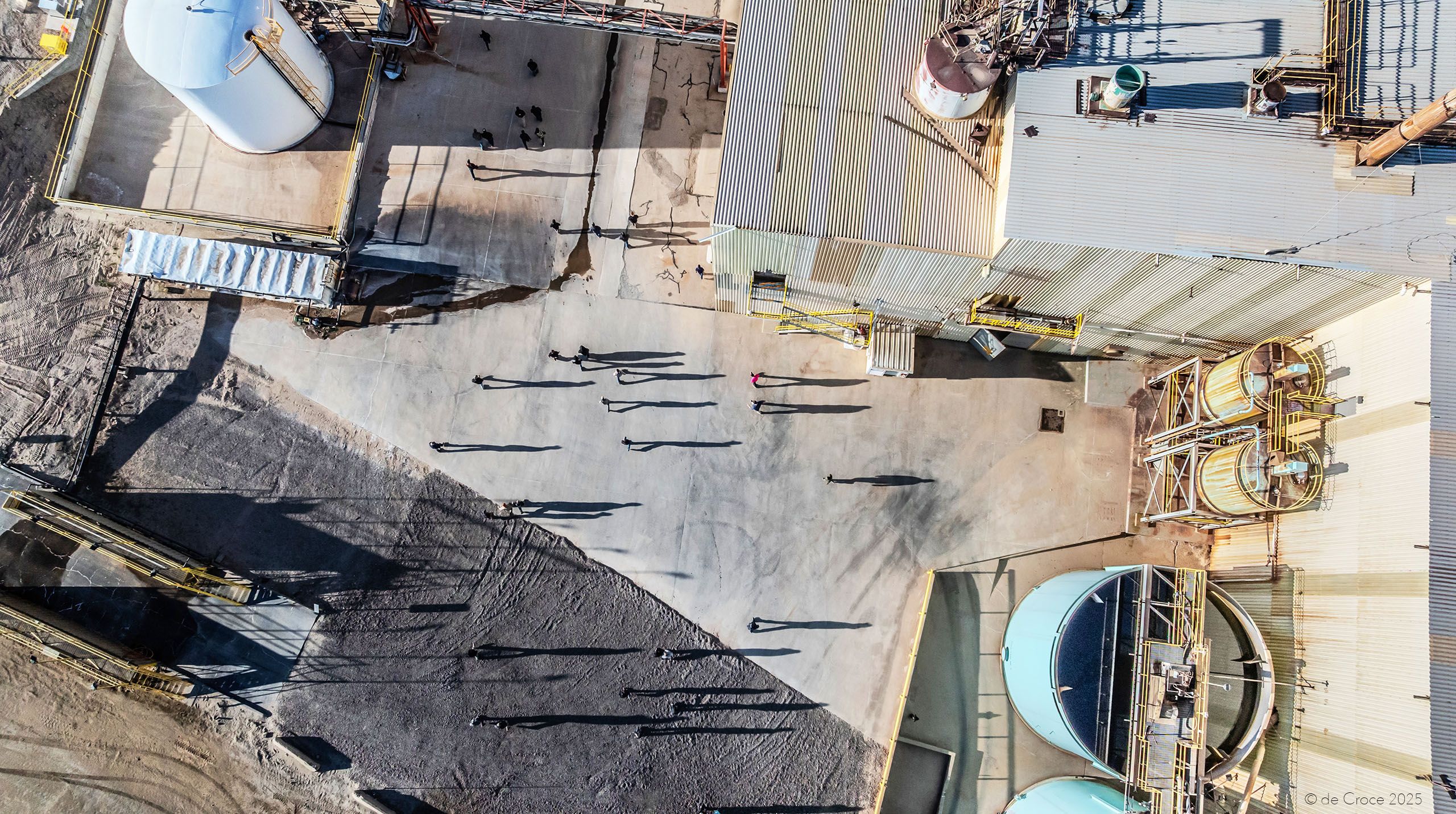 Commercial photography for industrial mining company - Energy Fuels - shows workers in shift change as shot from aerial drone at uranium mill in Utah. Commercial Drone Photography - Industrial Shift Change - Utah