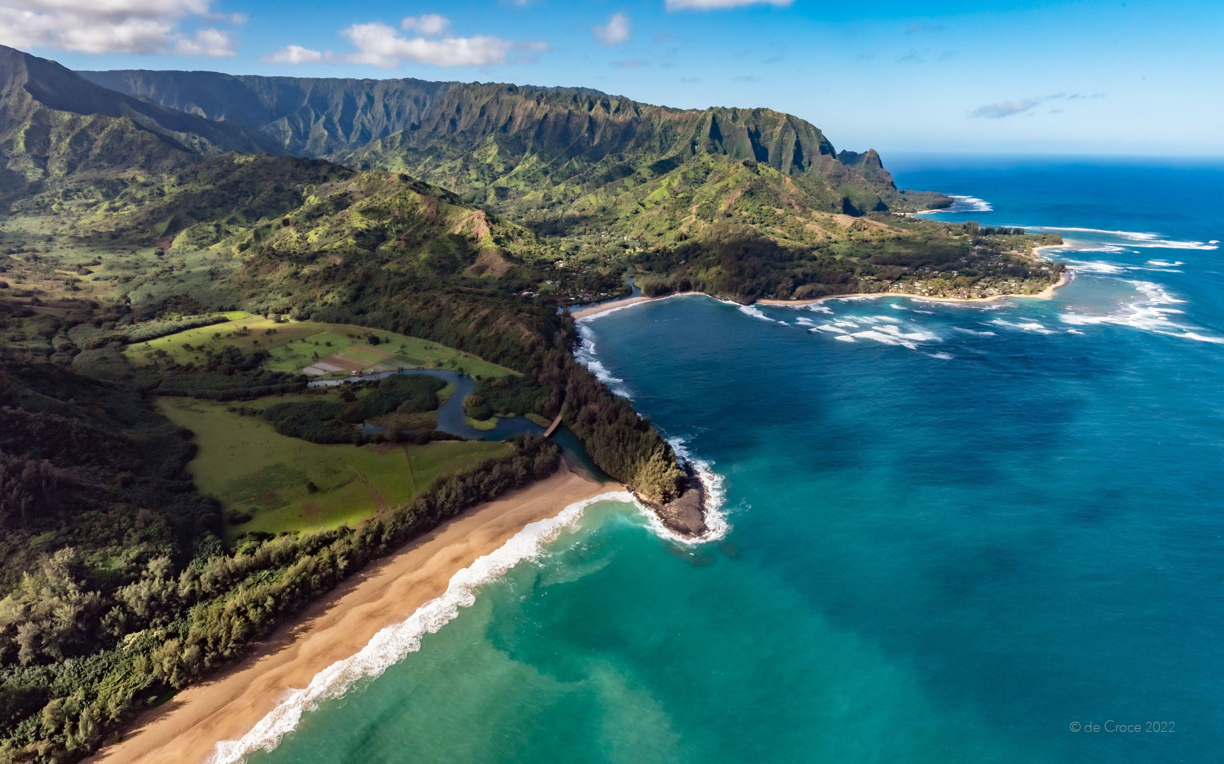 Hanalei Bay on the north coast of Kauai is captured on aerial travel photography for magazine. Hanalei Bay, Kauai - Aerial Travel Photography