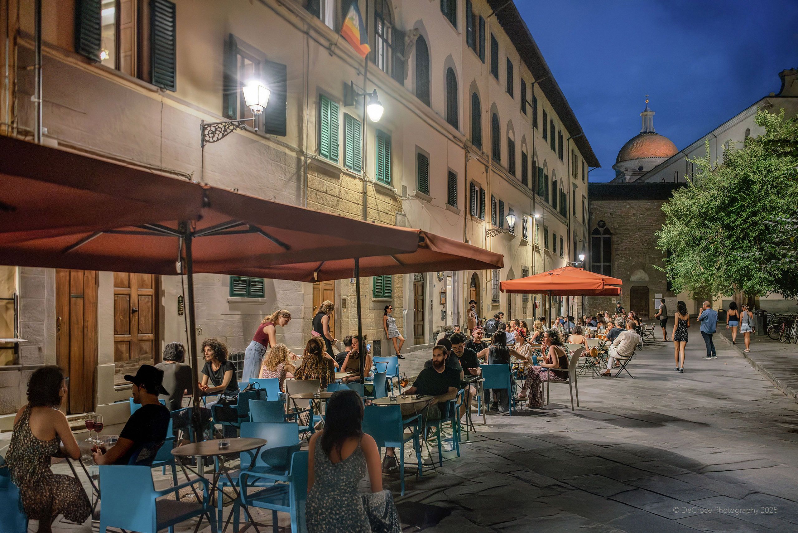 Travel photographer captures authentic street cafe scene during soft summer evening in Florence Italy. Firenze Italy Summer Street Cafe Travel Photography