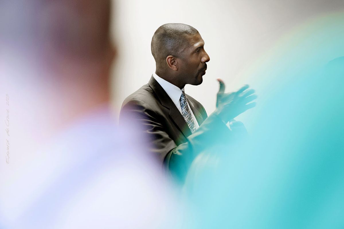 Corporate event photographers in Denver capture Quest Diagnostic Senior Vice President, Everett Cunningham during corporate speech. Corporate Photography - Everett Cunningham