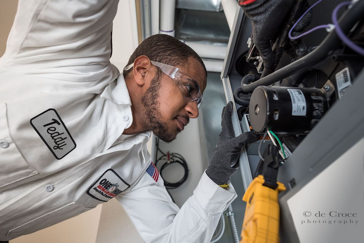 One Hour Plumbing advertisement photography of worker furnace repair Repair Worker commercial.jpg