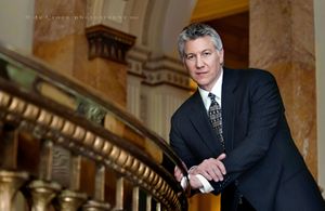 In 2013, corporate Denver photographers at DeCroce created this low angle portrait at the Colorado capitol. Portrait Executive Colorado Capitol