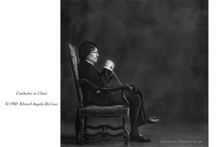 Denver photographer Edward Angelo DeCroce, father of Edward C. DeCroce created this portrait photograph in his Denver portrait studio circa 1980. Conductor in Chair ©1980 DeCroce