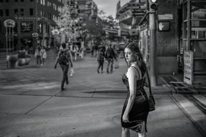 Black and white street actor by Denver photographer DeCroce. Light and shadow