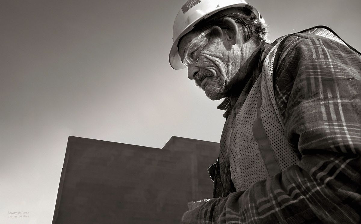 The face of this construction worker tells the story of a man's life. Captured while on a commercial photo-shoot for an ad agency at the end of a long day, This image in black and white, represents editorial photography and commercial photography. Construction Worker