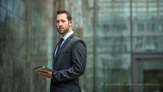 Corporate Denver photographer DeCroce created "Executive With Pad" in 2015 for Kelly & Walker LLC. The business portrait is part of a collection of corporate images created for the firm. Corporate Photyography - Executive With Pad ©2015