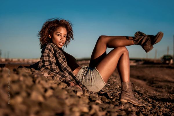 Denver model photographers drom DeCroce capture duotone image of young model in brown and blue. Model In brown